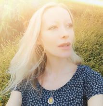 Load image into Gallery viewer, girl wearing a best mood rings mood pendant locket necklace in the sun