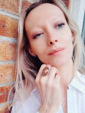 Load image into Gallery viewer, blonde model wearing large mood ring leaning next to wall