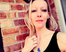 Load image into Gallery viewer, beautiful model wearing silver mood ring and silver mood locket