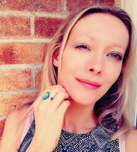 Load image into Gallery viewer, mood ring model wearing an oval mood ring with adjustable band by best mood rings