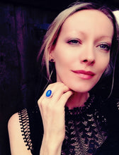 Load image into Gallery viewer, a model wearing a sterling silver mood ring with a blue color meaning by best mood rings