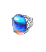Load image into Gallery viewer, an oval mood ring with marble swirl pattern