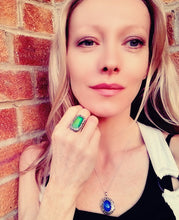 Load image into Gallery viewer, model wearing a rectangular mood ring with stones and a locket mood necklace