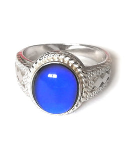 a sterling silver ring showing a blue color
