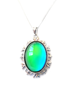 sterling silver mood pendant necklace with an oval mood turning a green mood color