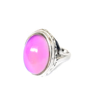Load image into Gallery viewer, a sterling silver mood ring that shows an oval mood with a pink mood color. Hallmarked by best mood rings