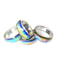 Load image into Gallery viewer, mood rings with swirl marble patterns in stainless steel