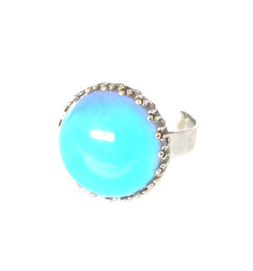 a circular mood ring in blue color with an adjustable band