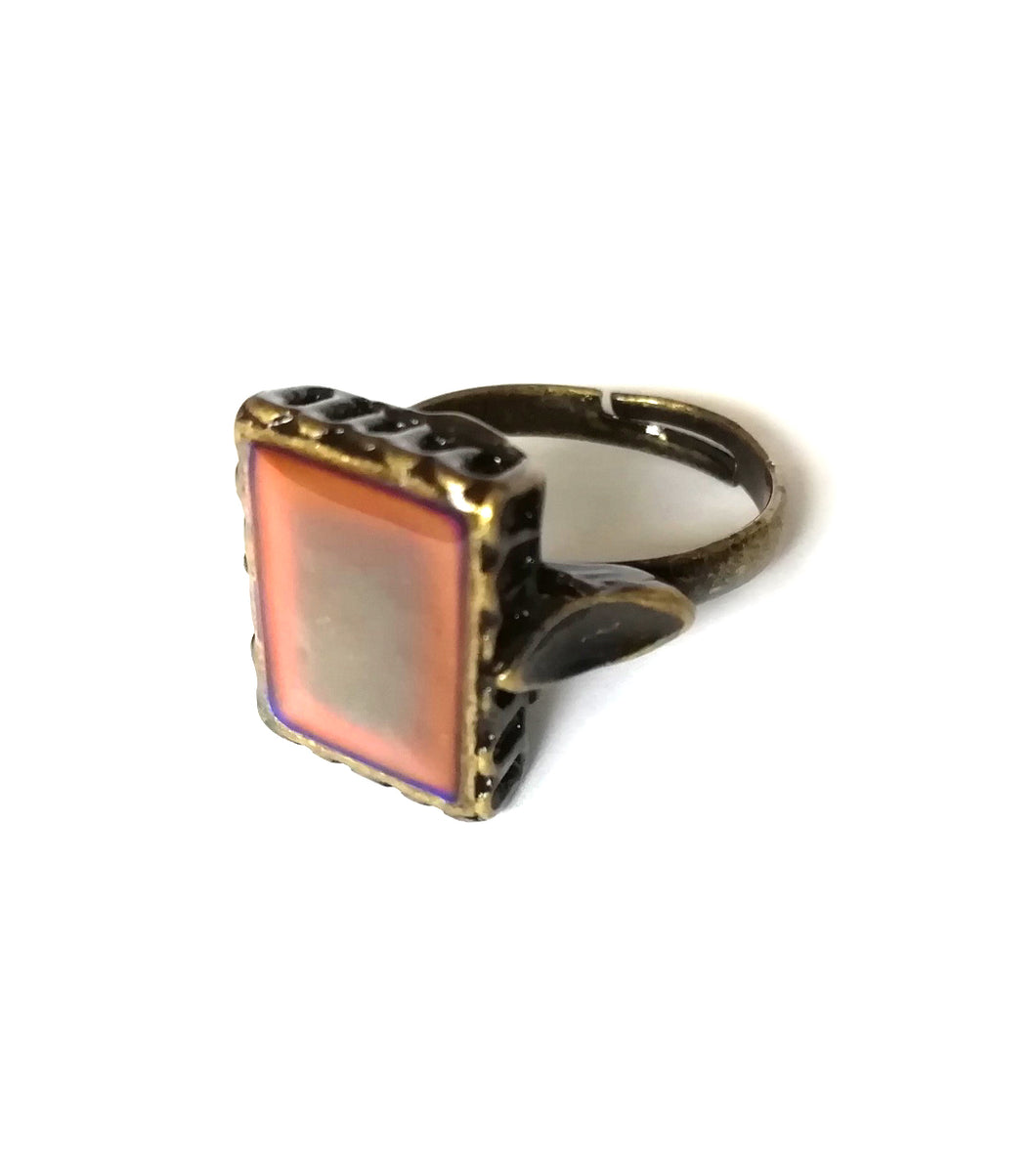 a bronze mood ring with a square mood and adjustable band