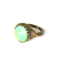 Load image into Gallery viewer, bronze mood ring with crown setting showing a green color mood in bronze metal