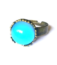 Load image into Gallery viewer, a bronzed mood ring with circular mood shape showing a blue color meaning by best mood rings