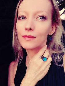 model wearing circular brass mood ring in a bronze shade by best mood rings