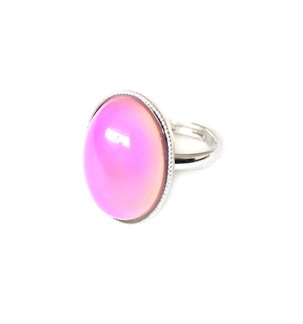 a mood ring with adjustable band and pink mood color