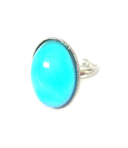 an adjustable mood ring with a turquoise color