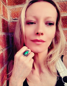blonde model wearing a horse eye shaped mood ring with adjustable band