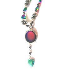Load image into Gallery viewer, a magnetic mood ring with a circular mood bead and hearts