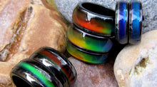 Load image into Gallery viewer, magnetic mood rings lying on the beach by best mood rings