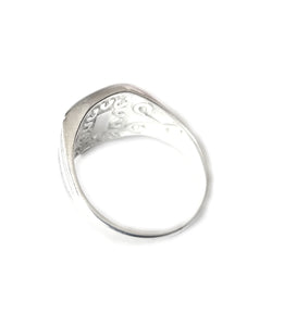 the back of a men's mood ring showing engraving 