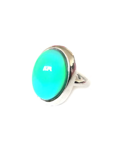 an oval mood ring with a silver plated adjustable band