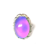 Load image into Gallery viewer, a mood ring with an oval shape and purple color mood meaning