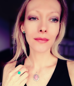 model wearing mood earrings, a silver mood ring and a silver mood locket pendant by best mood rings