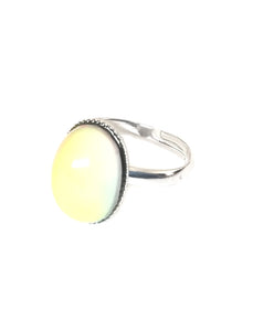 an oval mood ring turning a yellow mood color