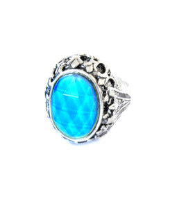 an adjustable mood ring turning a blue color