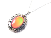 Load image into Gallery viewer, a sterling silver oval mood pendant locket with a silver chain