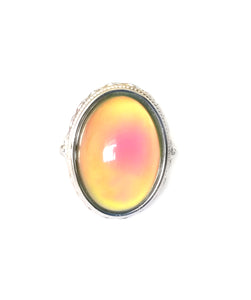 a sterling silver oval mood ring turning an orange mood color