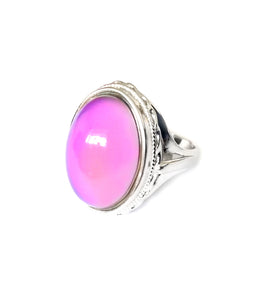 a sterling silver mood ring that shows an oval mood with a pink mood color. Hallmarked by best mood rings