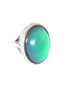 sterling silver mood ring with an oval mood showing a beautiful green color mood meaning