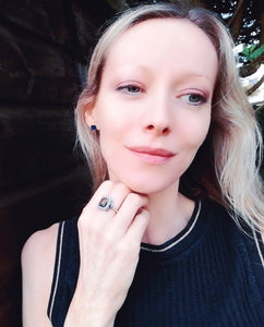 model wearing a vintage style mood ring in the garden